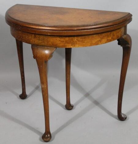 A burr walnut demi-lune card table