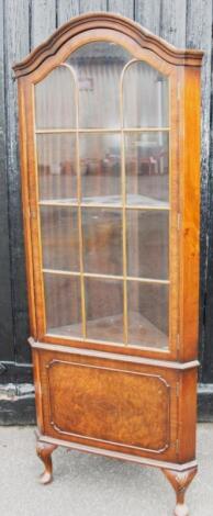 A George I style walnut corner cabinet