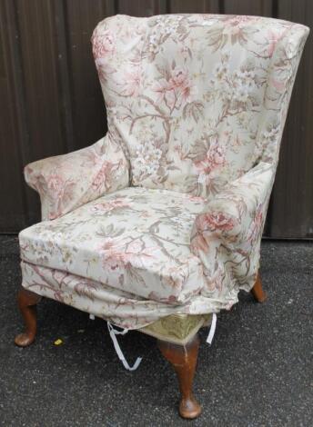 A George I style walnut framed wing armchair