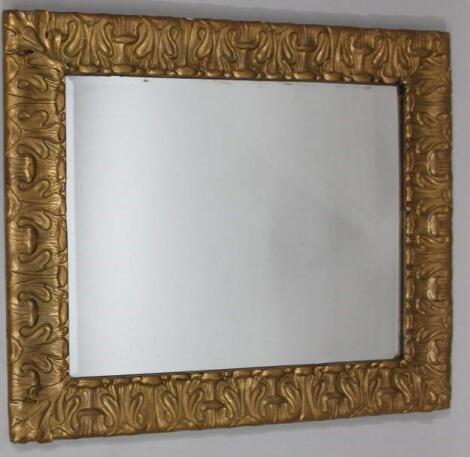 A 19thC Arts & Crafts style wall mirror