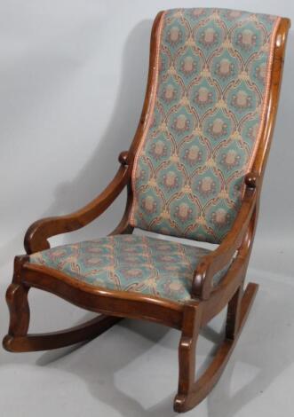 A late Victorian mahogany rocking chair