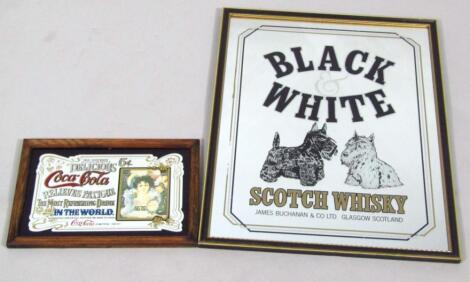 A reproduction Black and White Scotch Whiskey advertising mirror