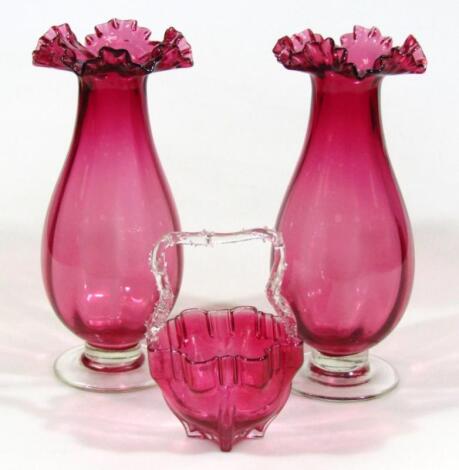 A pair of 20thC cranberry glass handkerchief vases