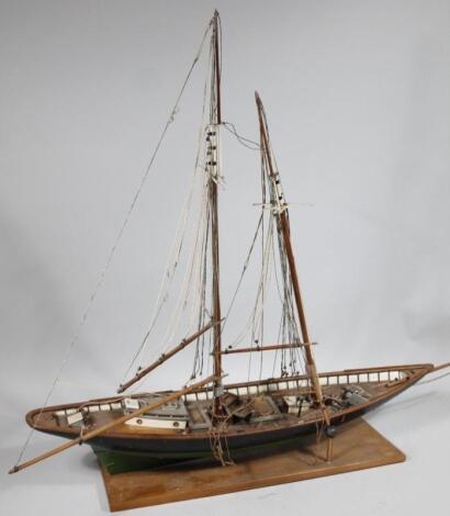 A table top scale model of wooden masted yacht clipper