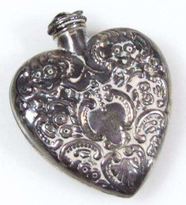 A silver heart shaped perfume bottle - 2