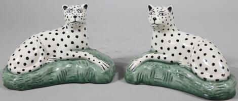 A pair of Staffordshire style pottery wild cats