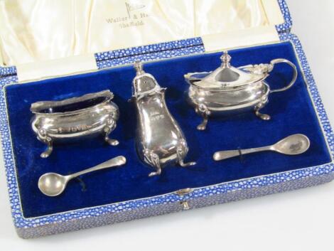 A George VI silver three piece cruet set