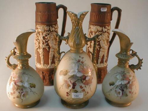 A garniture of three floral painted Vienna vases and a further pair of