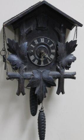 An early 20thC ebonised Black Forest style cuckoo clock