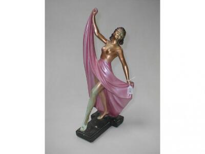 A 1920's Art Deco polychrome plaster figure of a topless female dancer