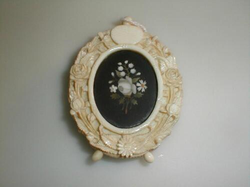 A Victorian ivory oval pendant easel frame