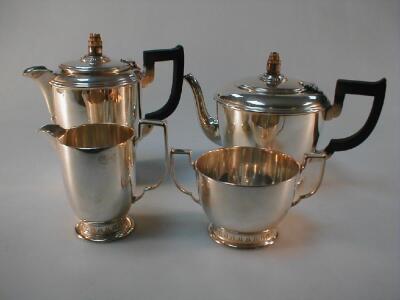 A George VI silver 4 piece tea set of circular design with lappet border