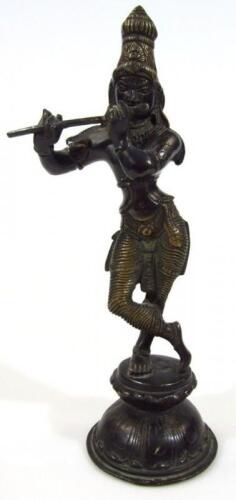 A 19thC bronze Indian figure of Krishna dressed in finery