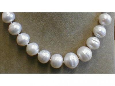 A large freshwater pearl necklace with silver colour catch