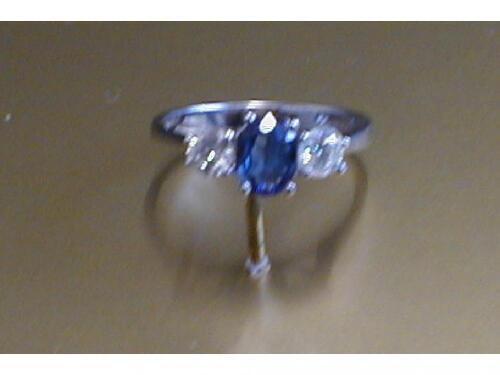 A sapphire and diamond set three stone ring in white 18 ct gold