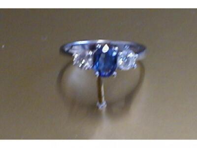 A sapphire and diamond set three stone ring in white 18 ct gold