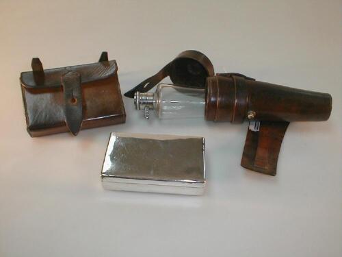 A George V silver mounted hunting flask in a leather taper belt holster and a folding case