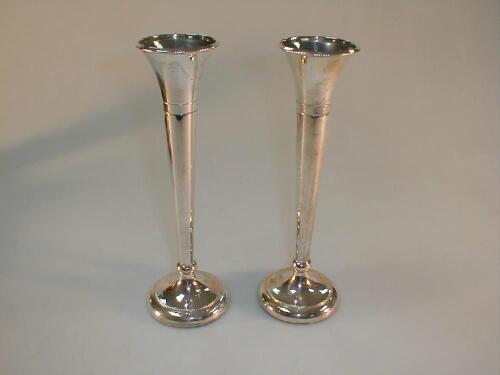 A pair of modern silver spill vases