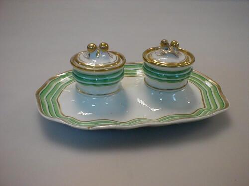 A KPM Berlin porcelain ink stand with two wells with lids and wavy gilt