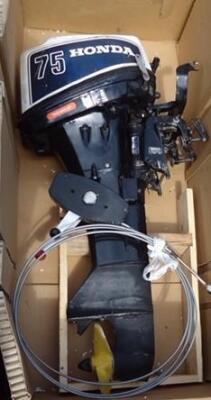 A Honda 75 long shaft outboard motor