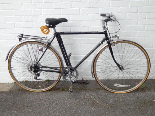 A Raleigh black framed gentleman's bicycle.