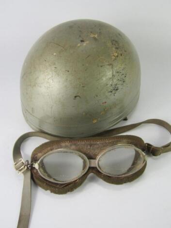 A Classic motorcycle helmet or scull cap and goggles.