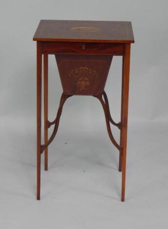 An Edwardian mahogany sewing table