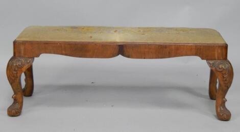 A Georgian style walnut veneered and carved beech stool