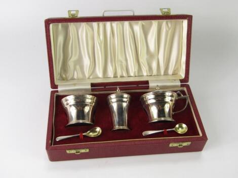 A silver three piece condiment set