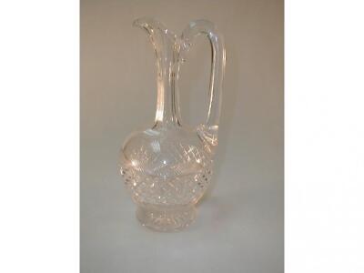 A cut crystal wine flask with star cut base