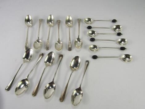 A set of six George V silver coffee spoons with bright cut engraving