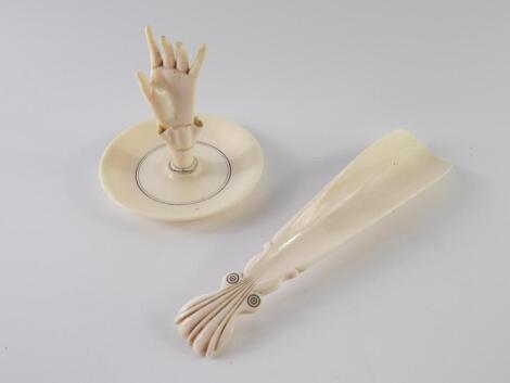 A Victorian ivory ring tree of hand form