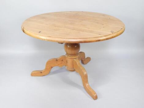 A Victorian style stripped pine circular breakfast table