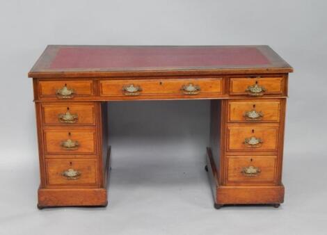 A late Victorian walnut pedestal desk