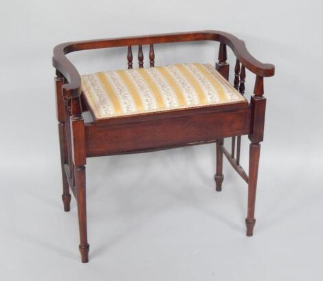 An Edwardian mahogany dressing table stool