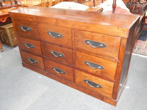 A hardwood low chest of nine drawers