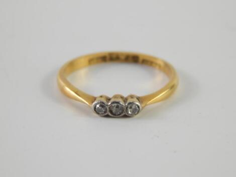 A three stone diamond set child's ring