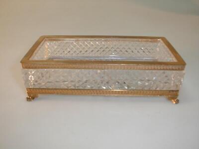 A heavy glass pen tray with star cut base