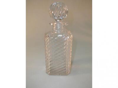 A cut glass spirit decanter of square form