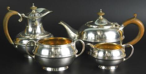 A George V silver associated four piece tea service