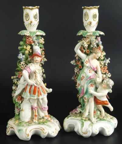 A pair of late 18th/early 19thC Derby porcelain candlestick figures