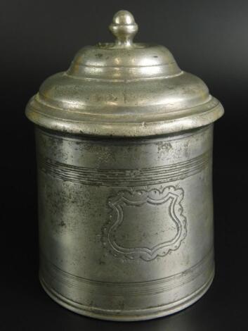 An early 19thC circular pewter tobacco box and cover