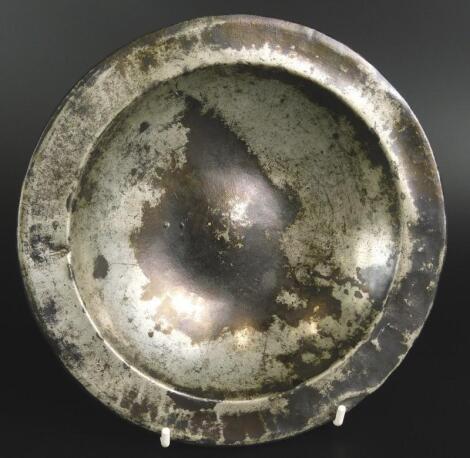 A 16thC deep bossed pewter plate