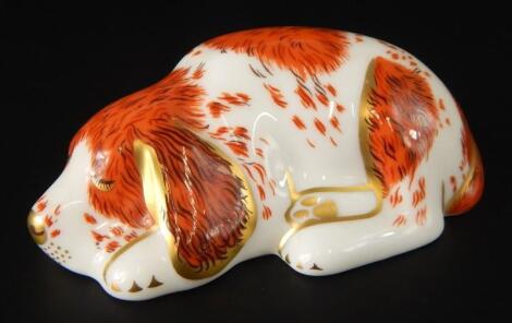 A Royal Crown Derby porcelain model of a sleeping dog