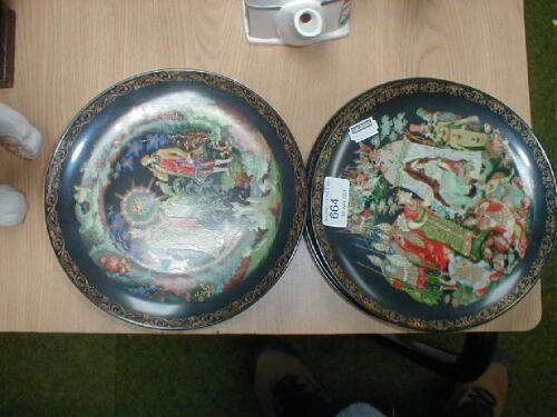 A collection of collectors plates with a medieval theme