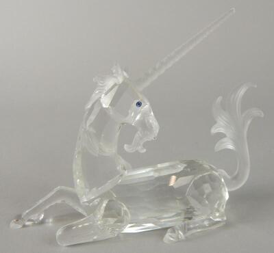 A Swarovski figure of a seated unicorn