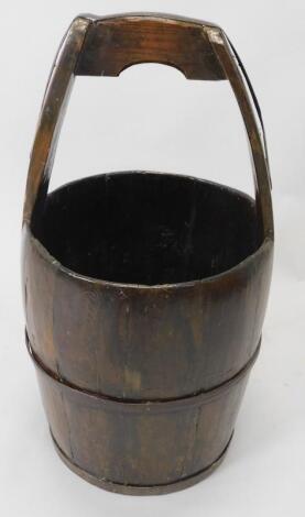 An oriental wooden coopered bucket