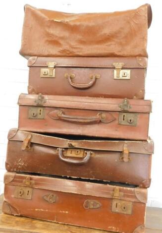 A collection of four vintage style suitcases