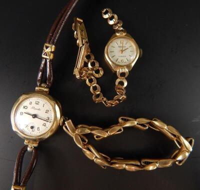 Two wristwatches and a strap