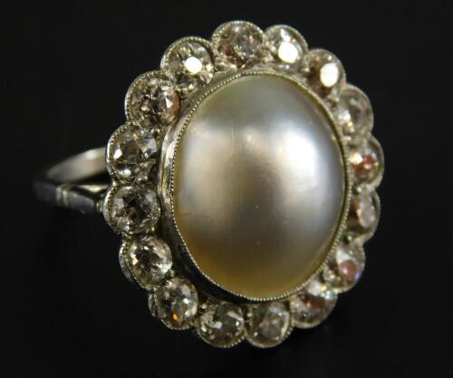 A pearl and diamond dress ring